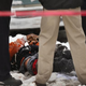 Police investigate a homicide scene after a 24-year-old man was found dead with a gunshot to his back along a sidewalk in the Lawndale neighborhood of Chicago on Dec. 15, 2013.
Scott Olson/Getty Images